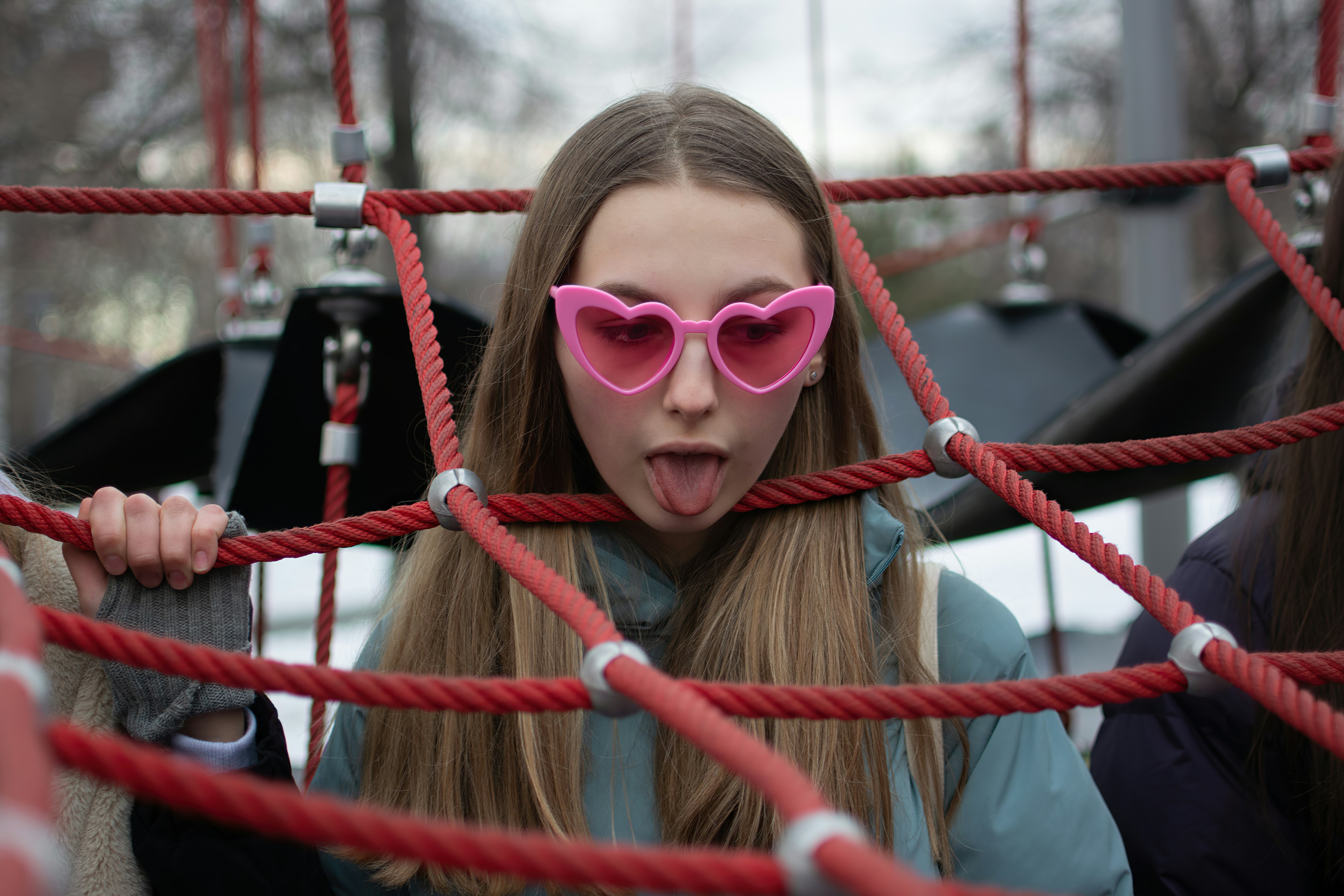 girl in white long sleeve shirt wearing brown sunglasses